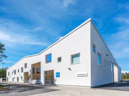 A white building with wooden features.