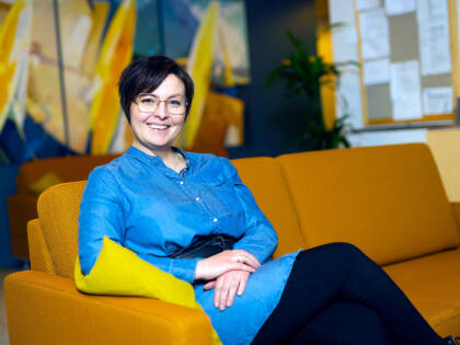 Woman sitting on a sofa.